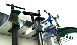 Image of wall mounted pipe clamp rack